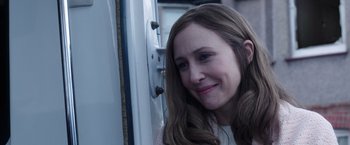Movie still from “The Conjuring 2” (2016), directed by James Wan – A person with long brown hair; Close Up shot, Over the shoulder angle