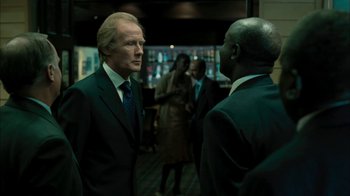 Movie still from “The Constant Gardener” (2005), directed by Fernando Meirelles – Two men in business suits talking to each other; Medium shot, Over the shoulder angle