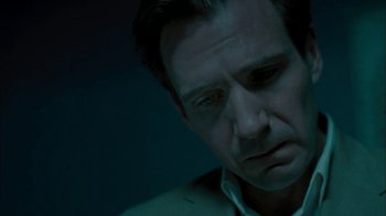 Movie still from “The Constant Gardener” (2005), directed by Fernando Meirelles – A person looking down at the ground; Close Up shot, Low angle