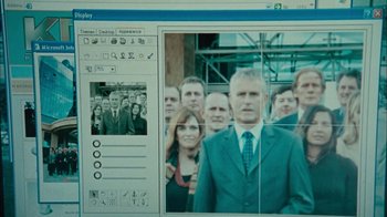 Movie still from “The Constant Gardener” (2005), directed by Fernando Meirelles – A computer screen showing a group of people in suits; Extreme Close Up shot, High angle