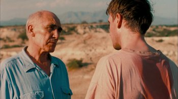 Movie still from “The Constant Gardener” (2005), directed by Fernando Meirelles – Two men are talking in the desert; Close Up shot, Over the shoulder angle