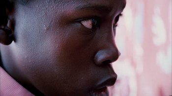 Movie still from “The Constant Gardener” (2005), directed by Fernando Meirelles – A person's eye with water droplets on it; Extreme Close Up shot, Low angle