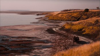 Movie still from “The Constant Gardener” (2005), directed by Fernando Meirelles – A body of water near a body of land; Extreme Wide shot, High angle