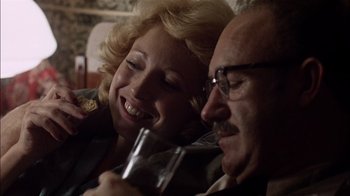 Movie still from “The Conversation” (1974), directed by Francis Ford Coppola – A man and a woman sitting next to each other; Close Up shot, Over the shoulder angle