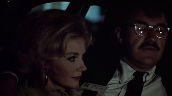 Movie still from “The Conversation” (1974), directed by Francis Ford Coppola – A woman sitting next to a man in a car; Close Up shot, Low angle