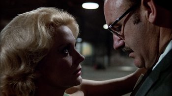 Movie still from “The Conversation” (1974), directed by Francis Ford Coppola – A man and a woman looking into each others eyes; Close Up shot, Low angle