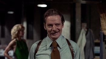 Movie still from “The Conversation” (1974), directed by Francis Ford Coppola – A person wearing a shirt and a tie; Close Up shot, Low angle