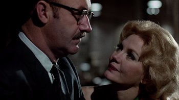 Movie still from “The Conversation” (1974), directed by Francis Ford Coppola – A man and a woman looking at one another; Close Up shot, Low angle