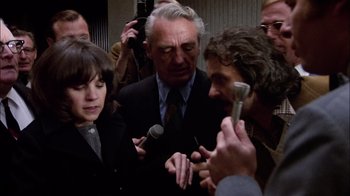 Movie still from “The Conversation” (1974), directed by Francis Ford Coppola – A group of people standing next to each other holding microphones; Close Up shot, Over the shoulder angle