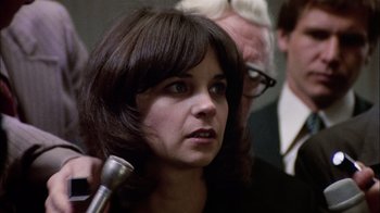 Movie still from “The Conversation” (1974), directed by Francis Ford Coppola – A person holding a hair dryer; Close Up shot, Over the shoulder angle