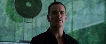 Movie still from “The Counselor” (2013), directed by Ridley Scott – A person wearing a black shirt; Close Up shot, Low angle