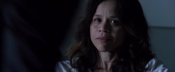 Movie still from “The Counselor” (2013), directed by Ridley Scott – A person with long dark hair; Close Up shot, Over the shoulder angle