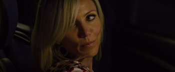Movie still from “The Counselor” (2013), directed by Ridley Scott – A woman's face in the dark; Close Up shot, Over the shoulder angle