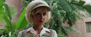 Movie still from “The Counselor” (2013), directed by Ridley Scott – A woman in a white hat holding a yellow pencil; Close Up shot, Low angle