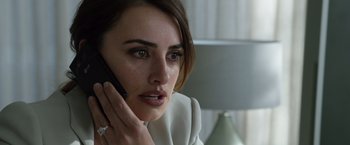 Movie still from “The Counselor” (2013), directed by Ridley Scott – A person talking on a cell phone; Close Up shot, Over the shoulder angle