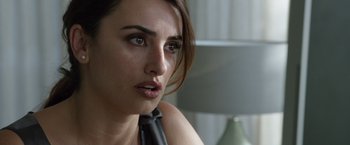 Movie still from “The Counselor” (2013), directed by Ridley Scott – A person wearing a neck tie; Close Up shot, Over the shoulder angle