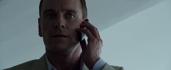 Movie still from “The Counselor” (2013), directed by Ridley Scott – A person talking on a cell phone; Close Up shot, Low angle