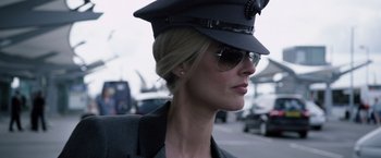 Movie still from “The Counselor” (2013), directed by Ridley Scott – A person wearing sunglasses and a hat; Close Up shot, Low angle