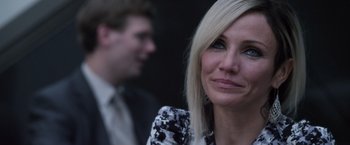 Movie still from “The Counselor” (2013), directed by Ridley Scott – A person wearing a suit and tie; Close Up shot, Over the shoulder angle