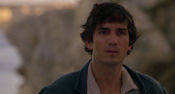 Movie still from “The Count of Monte Cristo” (2002), directed by Kevin Reynolds – A person wearing a jacket looking at the camera; Close Up shot, Over the shoulder angle