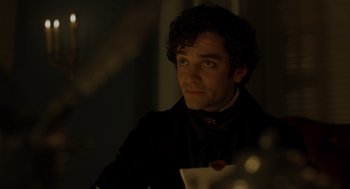 Movie still from “The Count of Monte Cristo” (2002), directed by Kevin Reynolds – A man with curly black hair wearing a black shirt; Close Up shot, Over the shoulder angle
