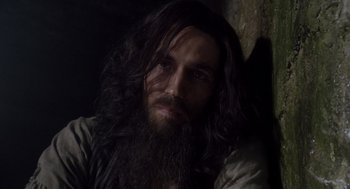 Movie still from “The Count of Monte Cristo” (2002), directed by Kevin Reynolds – A man with long hair and a long beard; Close Up shot, High angle
