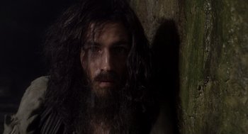 Movie still from “The Count of Monte Cristo” (2002), directed by Kevin Reynolds – A man with long hair and a long beard; Close Up shot, Low angle