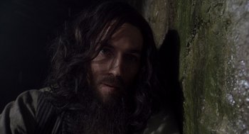 Movie still from “The Count of Monte Cristo” (2002), directed by Kevin Reynolds – A man with long hair and a long beard; Close Up shot, High angle