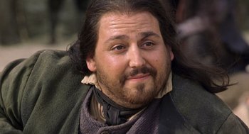 Movie still from “The Count of Monte Cristo” (2002), directed by Kevin Reynolds – A person with a beard wearing a scarf; Close Up shot, Low angle