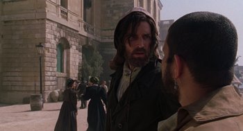 Movie still from “The Count of Monte Cristo” (2002), directed by Kevin Reynolds – A man with a long beard standing next to another man; Medium shot, Over the shoulder angle