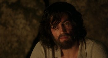Movie still from “The Count of Monte Cristo” (2002), directed by Kevin Reynolds – A man with long hair and a beard stares into the camera; Close Up shot, Over the shoulder angle