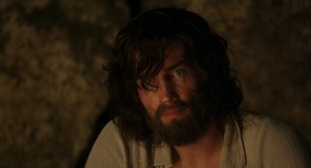 Movie still from “The Count of Monte Cristo” (2002), directed by Kevin Reynolds – A man with long hair and a beard stares at the camera; Close Up shot, Over the shoulder angle