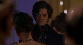 Movie still from “The Count of Monte Cristo” (2002), directed by Kevin Reynolds – A man in a black suit and a woman in a purple dress; Close Up shot, Over the shoulder angle