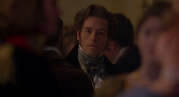 Movie still from “The Count of Monte Cristo” (2002), directed by Kevin Reynolds – A man in a suit and tie looking at the camera; Close Up shot, Over the shoulder angle
