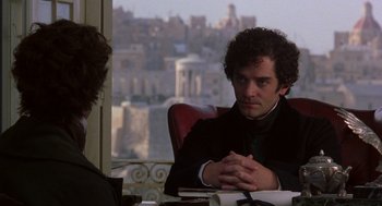 Movie still from “The Count of Monte Cristo” (2002), directed by Kevin Reynolds – A man sitting in front of another man at a table; Close Up shot, Over the shoulder angle