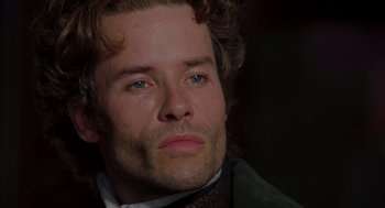 Movie still from “The Count of Monte Cristo” (2002), directed by Kevin Reynolds – A person wearing a suit and tie; Close Up shot, Over the shoulder angle