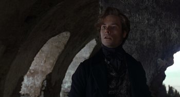 Movie still from “The Count of Monte Cristo” (2002), directed by Kevin Reynolds – A man wearing a black jacket and a black tie; Close Up shot, Low angle
