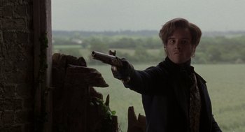 Movie still from “The Count of Monte Cristo” (2002), directed by Kevin Reynolds – A young man holding a gun in his hand; Medium shot, Over the shoulder angle
