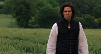 Movie still from “The Count of Monte Cristo” (2002), directed by Kevin Reynolds – A man standing in the middle of a green field; Close Up shot, Over the shoulder angle