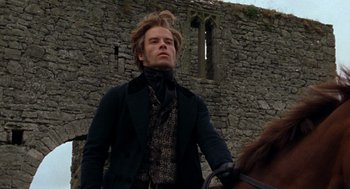 Movie still from “The Count of Monte Cristo” (2002), directed by Kevin Reynolds – A man standing next to a brown horse; Medium shot, Low angle