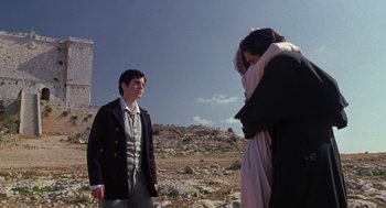 Movie still from “The Count of Monte Cristo” (2002), directed by Kevin Reynolds – Two people standing on a rocky hillside looking at each other; Wide shot, Over the shoulder angle