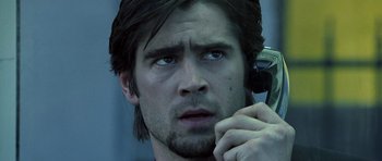 Movie still from “Phone Booth” (2002), directed by Joel Schumacher – A person talking on a cell phone; Close Up shot, Low angle