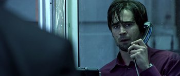 Movie still from “Phone Booth” (2002), directed by Joel Schumacher – A man with long hair is looking at himself in the mirror; Close Up shot, Over the shoulder angle