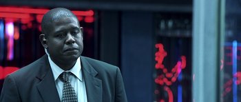 Movie still from “Phone Booth” (2002), directed by Joel Schumacher – A man in a suit and tie; Close Up shot, Low angle