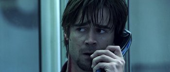 Movie still from “Phone Booth” (2002), directed by Joel Schumacher – A person talking on a cell phone; Close Up shot, Low angle