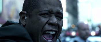 Movie still from “Phone Booth” (2002), directed by Joel Schumacher – A person with a mouth wide open; Close Up shot, Low angle