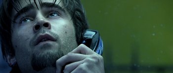 Movie still from “Phone Booth” (2002), directed by Joel Schumacher – A person using a hair trimmer; Close Up shot, Low angle