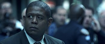 Movie still from “Phone Booth” (2002), directed by Joel Schumacher – A man in a suit and a tie; Close Up shot, Low angle