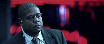 Movie still from “Phone Booth” (2002), directed by Joel Schumacher – A man in a suit and tie; Close Up shot, Over the shoulder angle