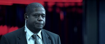 Movie still from “Phone Booth” (2002), directed by Joel Schumacher – A man in a suit and tie; Close Up shot, Over the shoulder angle